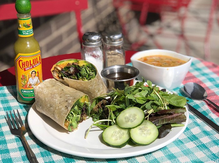 Healthy lunch wrap with soup and salad