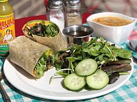 Healthy lunch wrap with soup and salad